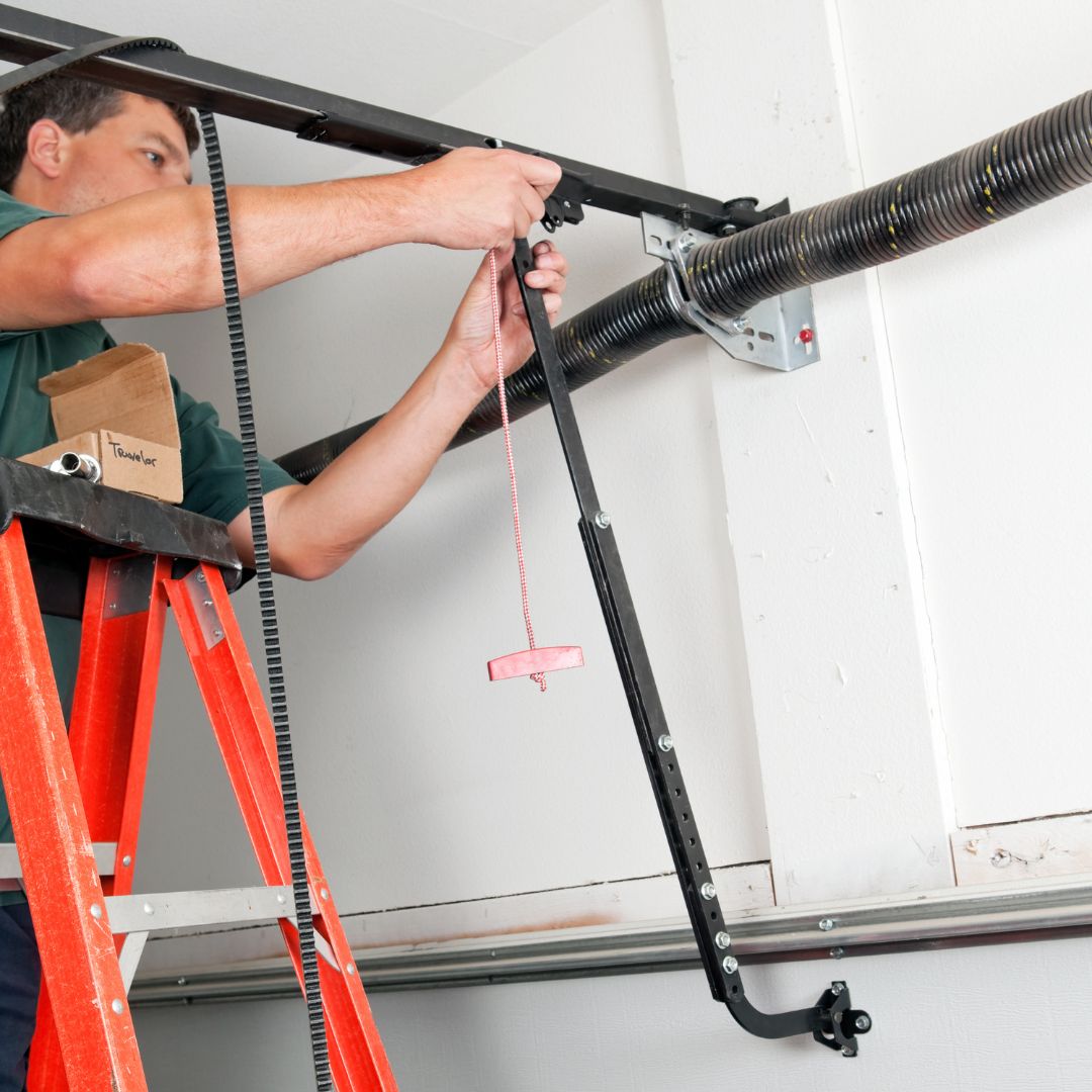 technician working on garage door