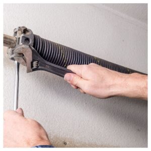 Wrench and garage door spring