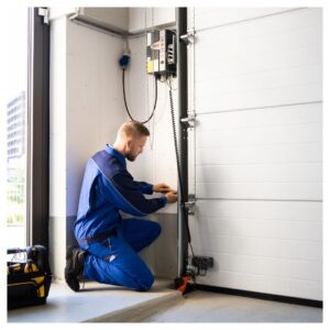 Worker fixing garage door