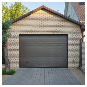 Brown garage door on a brick garage