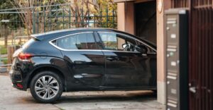 Car pulling into a garage door