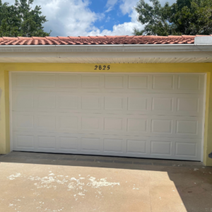 double garage door on yellow house