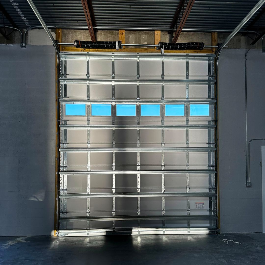 closed commercial garage door with windows