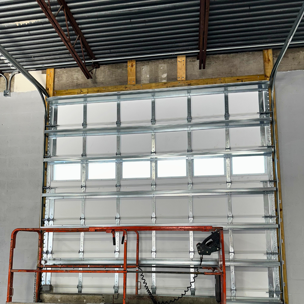 interior of garage door with high ceiling