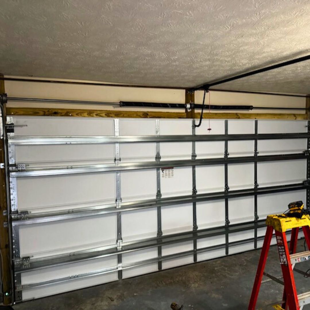 interior of a garage door being repaired