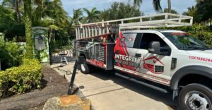 Integrity Garage Door Services truck parked outside home