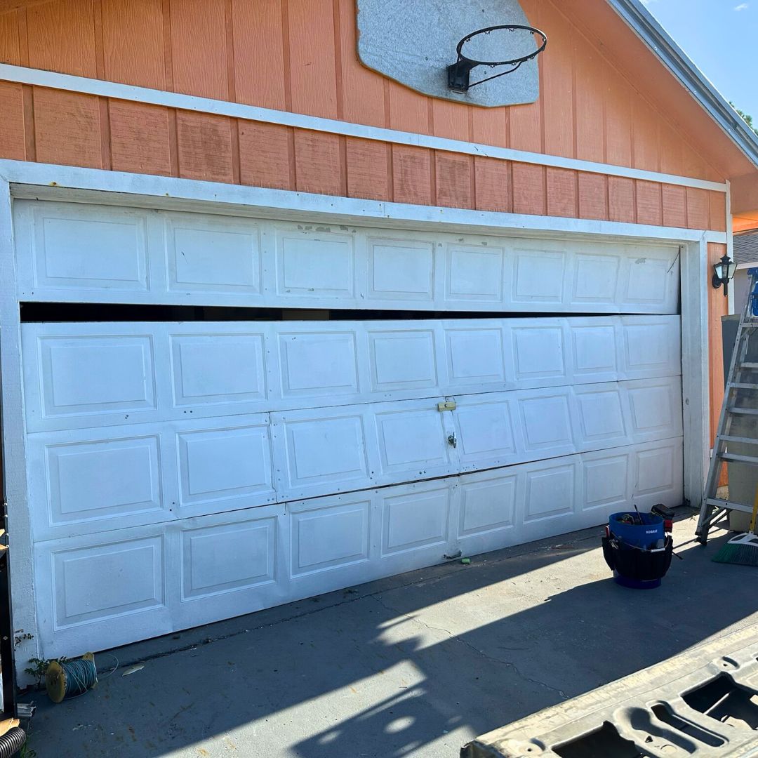 broken garage door on home