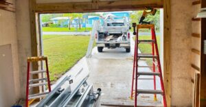 Integrity Garage Door Services truck and equipment parked outside garage door